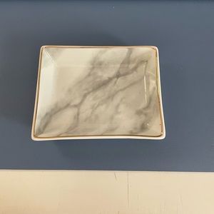 Ring dish with granite and gold look.